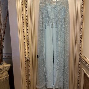 I have a brand new elegant evening  jumpsuit with a cape never
